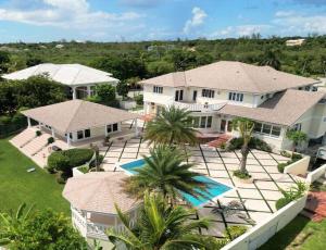 an aerial view of a house with a yard at Luxe Oasis: w/Pool & Lake Access in Nassau
