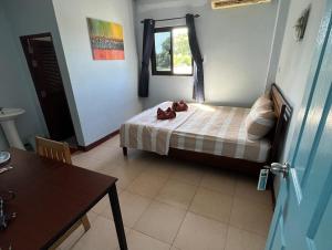 Postel nebo postele na pokoji v ubytování Guest House Blue Andaman