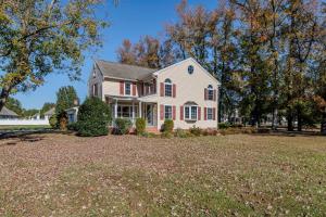 a house with a large yard at Peaceful 3BR Home Near SU, Sports Fields, Civic Center, Zoo & Ocean City in Salisbury