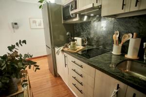 Kuchyňa alebo kuchynka v ubytovaní Salamanca Rentals - Apartamento con terraza a 1 minuto de la Plaza Mayor