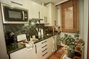 Kuchyňa alebo kuchynka v ubytovaní Salamanca Rentals - Apartamento con terraza a 1 minuto de la Plaza Mayor