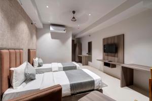 Voodi või voodid majutusasutuse Hotel Sparsh Divine toas