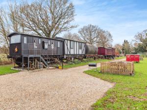 an old train on display in a park at The Brake Wagon in Halstead