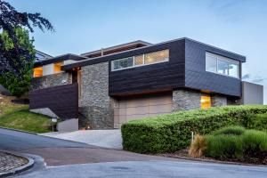 a house with a black roof at Amaroo in Queenstown