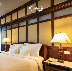 Postel nebo postele na pokoji v ubytování Chankam Boutique Hotel