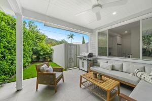 a living room with a couch and a table at Hamptons by Khove in Gold Coast