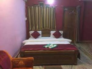 Katil atau katil-katil dalam bilik di MAA TARINI GUEST HOUSE,Bhubaneswar