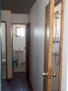 a bathroom with a toilet and a sink at República Hostel in Valparaíso