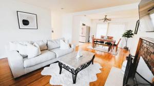 a living room with a couch and a table at Saikwan Valley Family Home in Milpitas