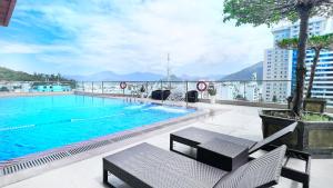 a swimming pool on the roof of a building at HiSea Nha Trang in Nha Trang