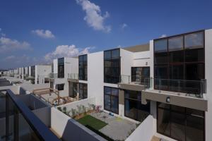an aerial view of an apartment building at Fabulous 4br villa with Balcony in Dubai
