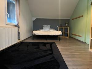 Katil atau katil-katil dalam bilik di Au doux passage