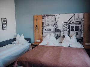Posteľ alebo postele v izbe v ubytovaní Levy's Rooms & Breakfast