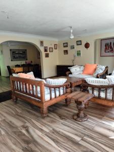 a living room with a couch and a table at Makao Nafuu Aprtments Malindi in Malindi