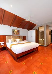 Łóżko lub łóżka w pokoju w obiekcie Palcastle Regency