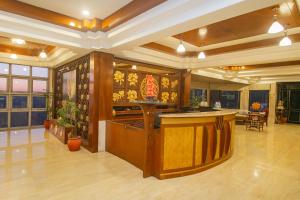 a lobby with a bar in the middle of a room at Amritara Surya - A Luxury Spa Retreat in Dharamshala
