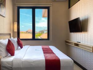 Postel nebo postele na pokoji v ubytování Svarna Suites Seminyak