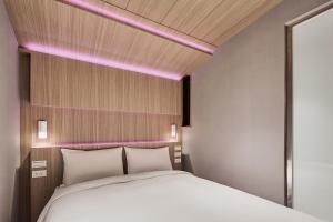Katil atau katil-katil dalam bilik di Orange Hotel -Hanzhong, Taipei