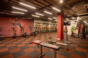 a gym with rows of exercise bikes in a room at First Joy Hotel in Trabzon