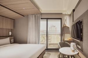 Katil atau katil-katil dalam bilik di Orange Hotel -Hanzhong, Taipei