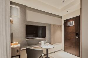 Televisyen dan/atau pusat hiburan di Orange Hotel -Hanzhong, Taipei