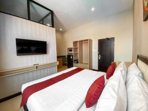 Postel nebo postele na pokoji v ubytování Svarna Suites Seminyak