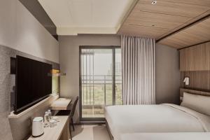 Katil atau katil-katil dalam bilik di Orange Hotel -Hanzhong, Taipei