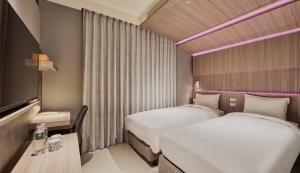 Katil atau katil-katil dalam bilik di Orange Hotel -Hanzhong, Taipei