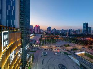 a view of a city with a lot of traffic at Wuyu Hotel - Chongqing Liangjiang Happiness Plaza in Chongqing