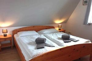 Postel nebo postele na pokoji v ubytování Strandmöwe, Haus Faltings Whg 2 OG mit Balkon