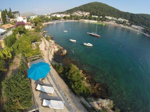 an aerial view of a beach with a blue umbrella at Dubrovnik Apartments in Dubrovnik