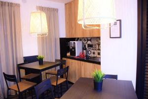 a restaurant with two tables and chairs and lights at La Dimora Del RE in Salerno