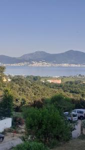 a parking lot with a view of a body of water at Charmant studio in Grosseto-Prugna