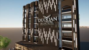a rendering of a building with a sign on it at duqqan deluxe hotel in Kuşadası