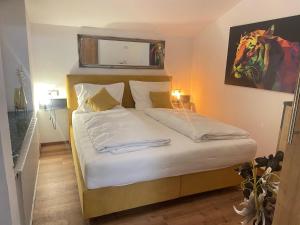 Katil atau katil-katil dalam bilik di Komfort-Apartments Waidring