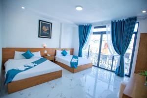Postel nebo postele na pokoji v ubytování Thanh Thanh Spa & Hotel
