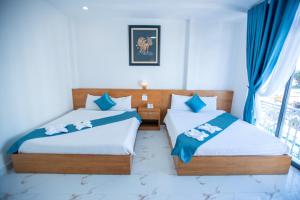 Postel nebo postele na pokoji v ubytování Thanh Thanh Spa & Hotel