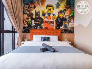 a bedroom with a bed with a lego wall at D'Pristine Suites by JBcity Home in Nusajaya