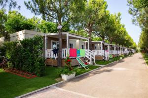 a row of mobile homes on the grass at Don Antonio Glamping Village in Giulianova