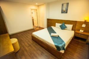 Postel nebo postele na pokoji v ubytování Thanh Thanh Spa & Hotel