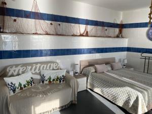 Posteľ alebo postele v izbe v ubytovaní SUITE ISOLA BELLA