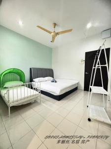 a bedroom with two beds and a ladder in it at 2 Storey House Bayu Mutiara @ Bukit Mertajam in Bukit Mertajam