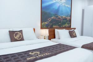 Tempat tidur dalam kamar di Big Hotel Lào Cai