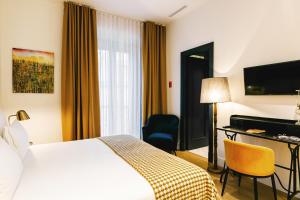 Postel nebo postele na pokoji v ubytování Joya del Casco Boutique Hotel by Shiadu
