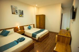 Postel nebo postele na pokoji v ubytování Thanh Thanh Spa & Hotel