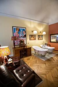 a large bathroom with a tub and a sink at Stella d'Italia in Florence