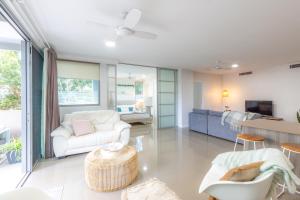 a living room with a couch and a table at Nova Apartments 104 Mooloolaba Beach in Mooloolaba