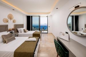 a hotel room with two beds and a mirror at Villa Eos - Kalkan Villa in Kaş +70 photos