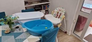 a bathroom with a toilet and a chair at Bob's House quiet retreat with large shared garden in Loughborough +24 photos
