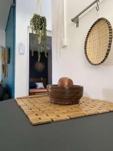 a basket sitting on a cutting board on a counter at La belle rencontre in Mamoudzou
